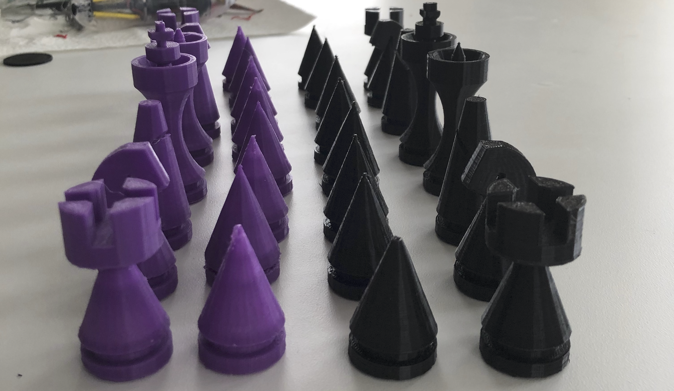 Complete 3D-printed chess set with purple and black pieces, all 32 pieces arranged