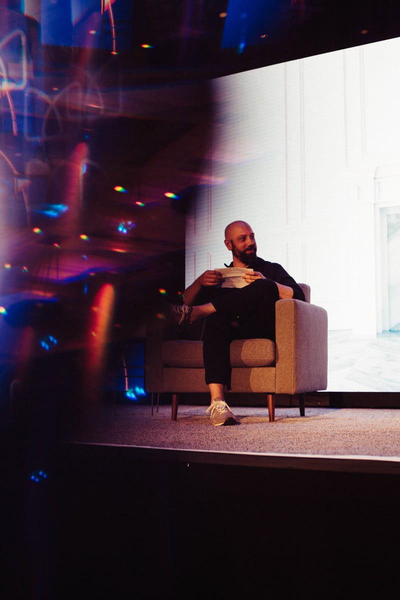 Ben Milne, Dwolla and Brale founder, seated on stage at Monetery